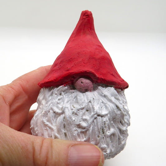 Chubby gnome with a pointed hat, handmade, cement indoor outdoor elf figurine.