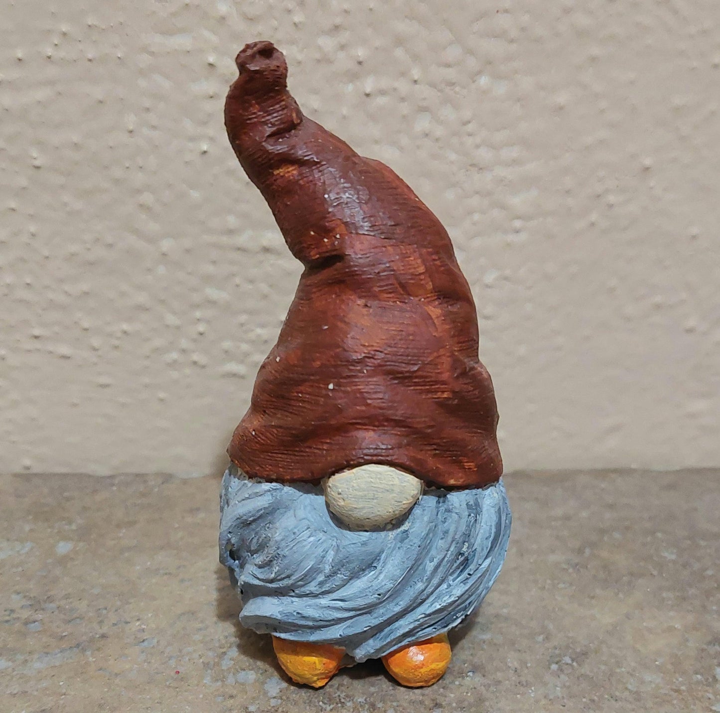 Miniature gnome with pointed hat and long beard: Holiday, home, office, or garden decor. Handmade cement statue.